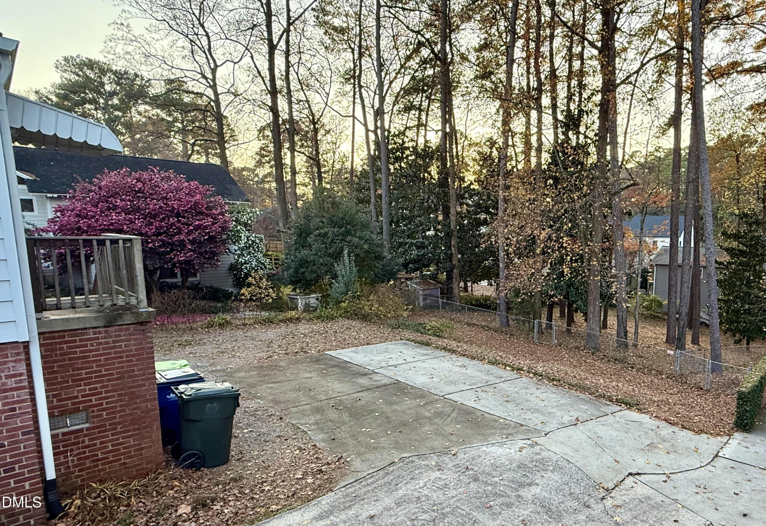 1313 Ridge Road Raleigh, NC 27607 - Photo 31 of 36 a view of a backyard with potted plants and large trees
