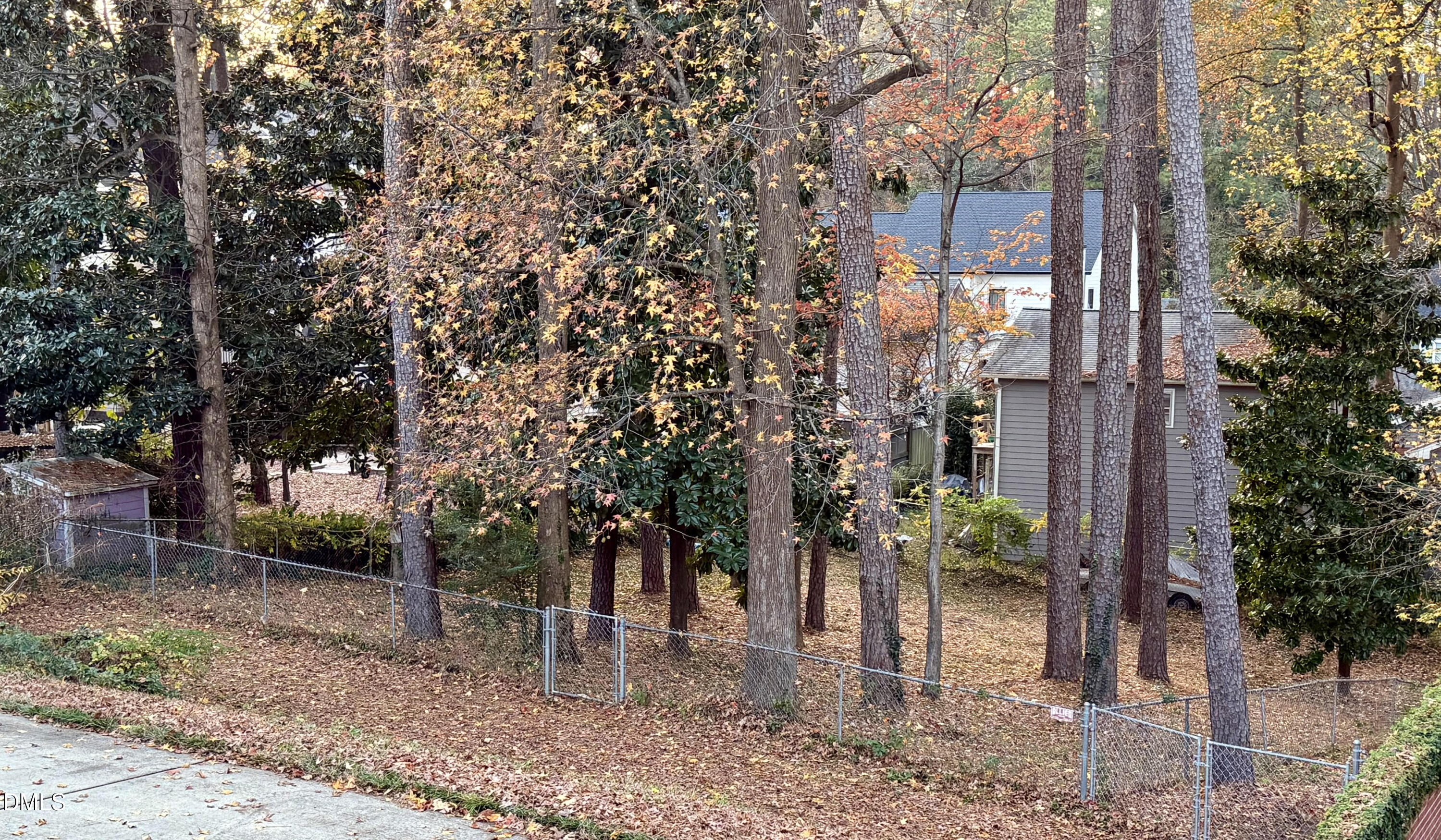 1313 Ridge Road Raleigh, NC 27607 - Photo 32 of 36 a view of a house with a yard