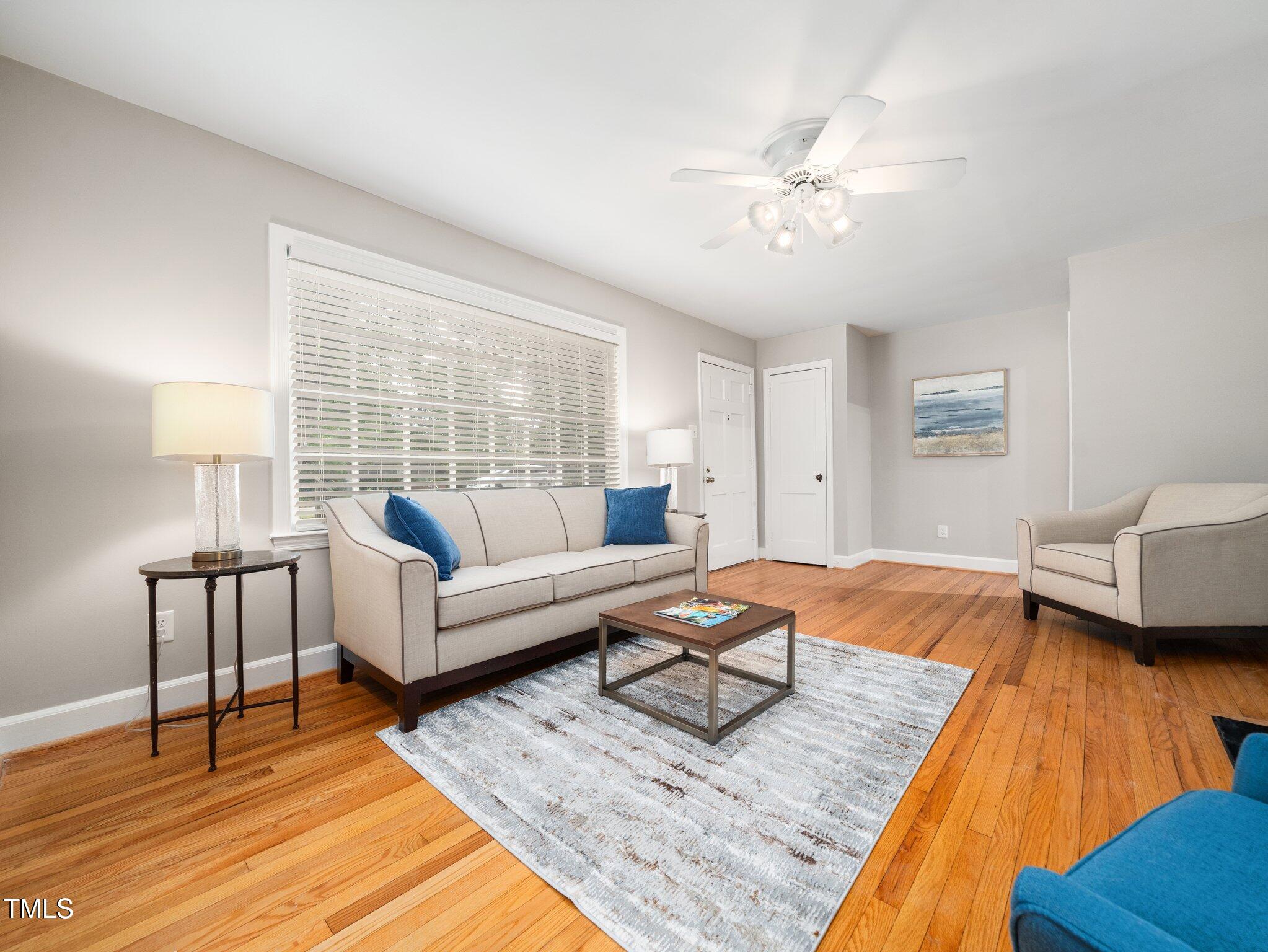 1313 Ridge Road Raleigh, NC 27607 - Photo 7 of 36 a living room with furniture and a wooden floor