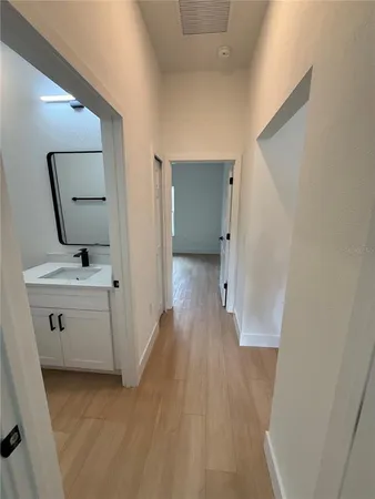 a white toilet sitting next to a bathroom sink
