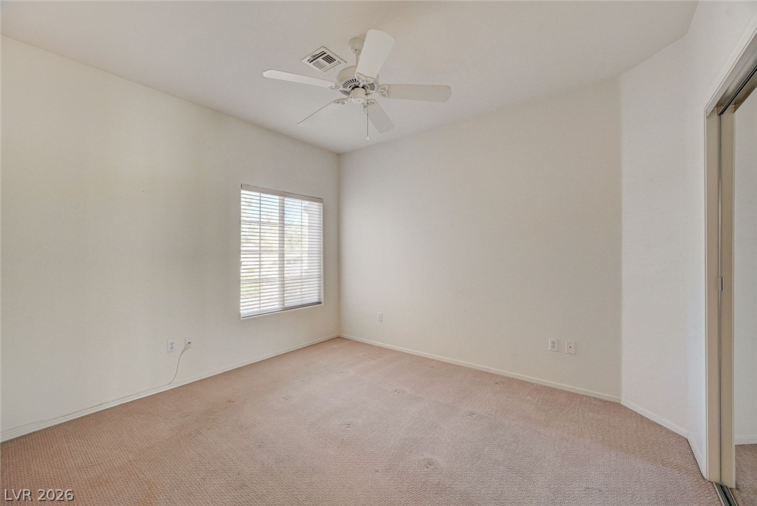 2529 Springville Way Henderson, NV 89052 - Photo 41 of 70 Plush carpeting and natural light define this versatile secondary bedroom space.