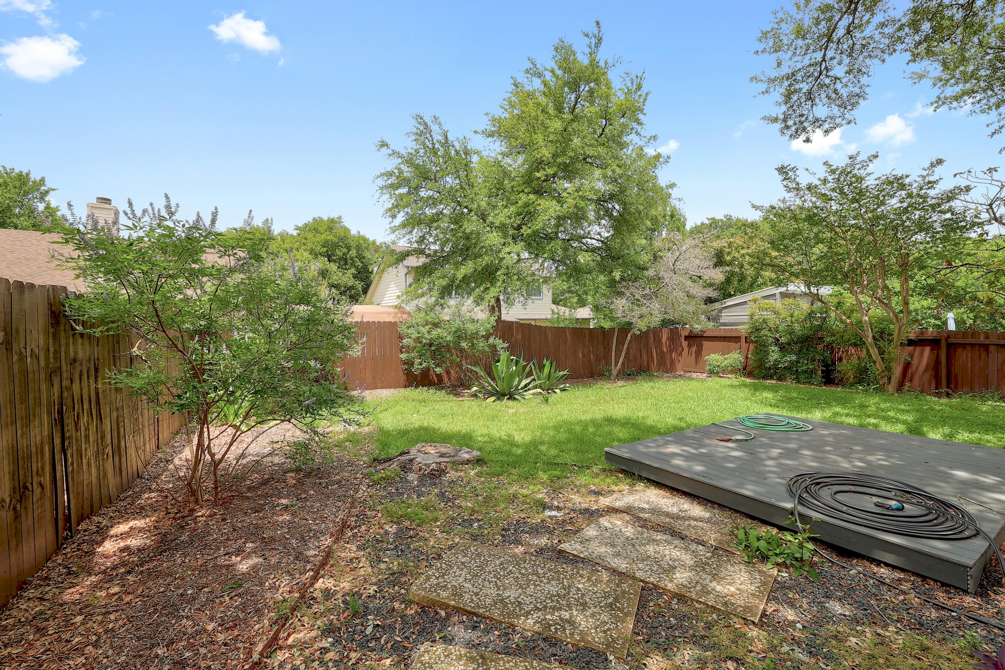 2202 Warfield Way Austin, TX 78728 - Photo 30 of 32 A well-maintained fenced backyard offers ample space for outdoor activities and relaxation.
