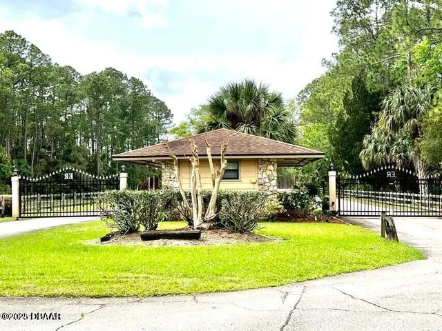 a view of a house with a swimming pool