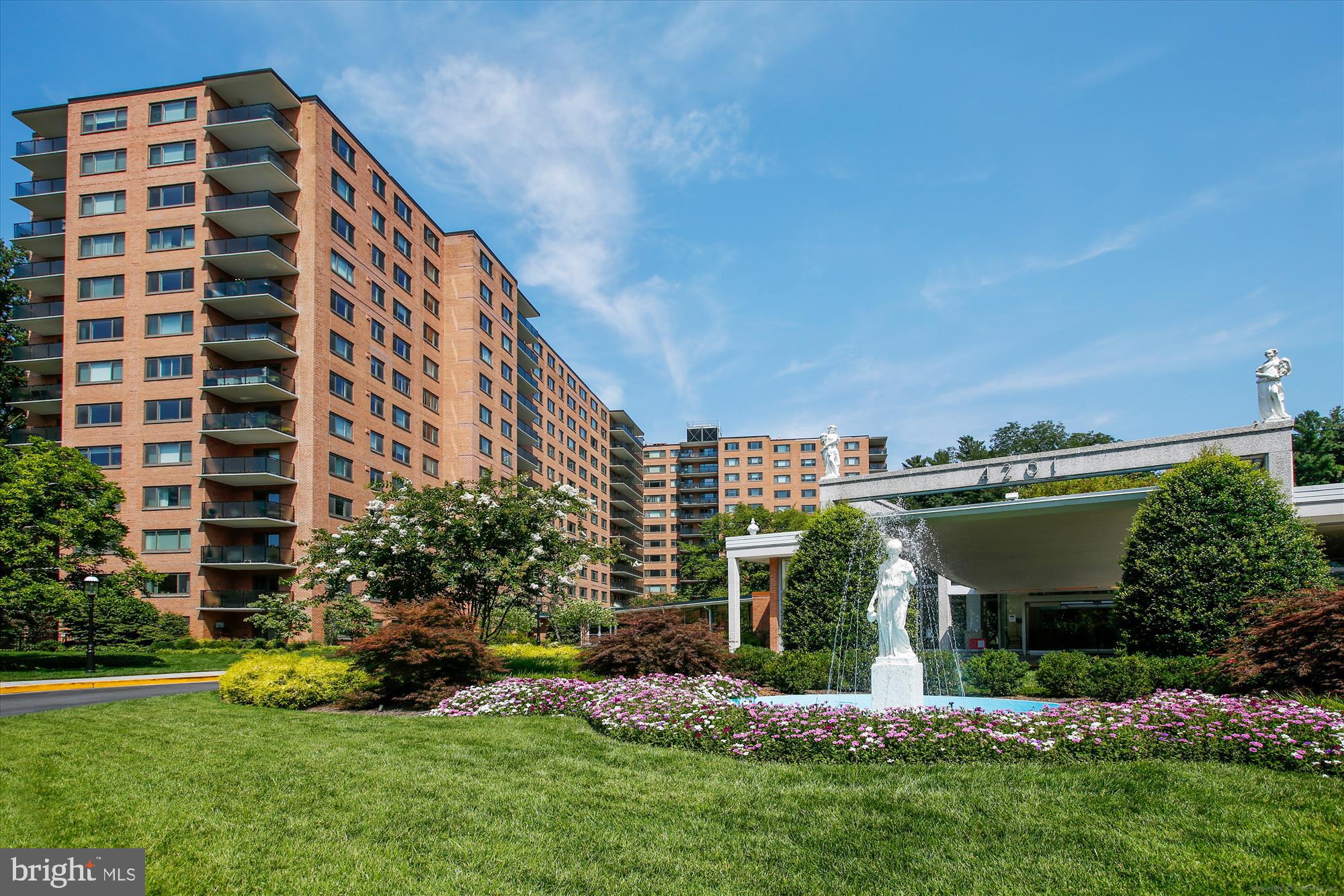 a view of a building with a yard
