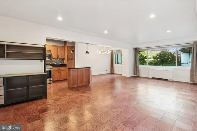 a view of a kitchen with a microwave and refrigerator