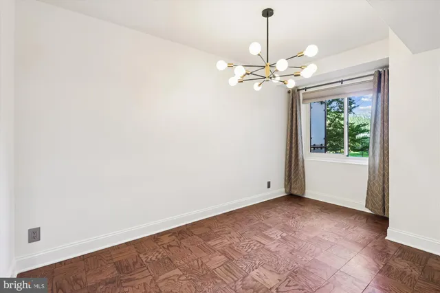 a view of a livingroom with a ceiling fan and window