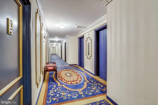a view of a hallway with a wooden door