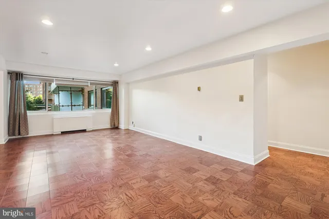 a view of kitchen with furniture and refrigerator