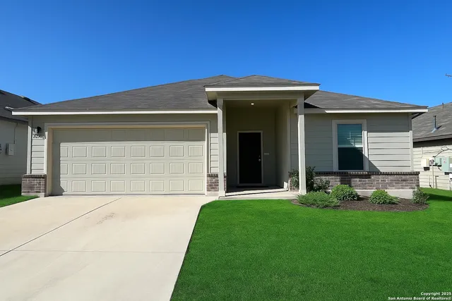 a front view of a house with a yard and porch