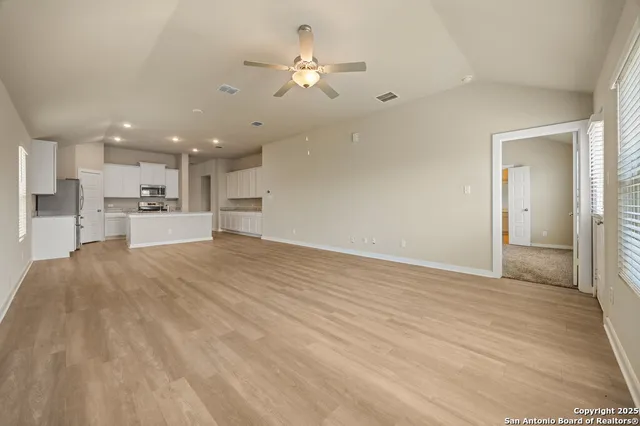 a view of a kitchen with a sink and a stove top oven