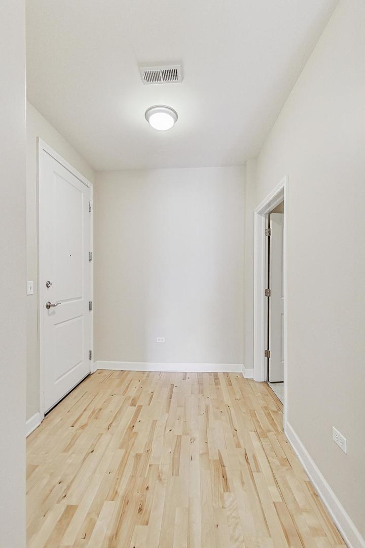 50 North Plum Grove Road, Unit 210E Palatine, IL 60067 - Photo 14 of 47 wooden floor in a room