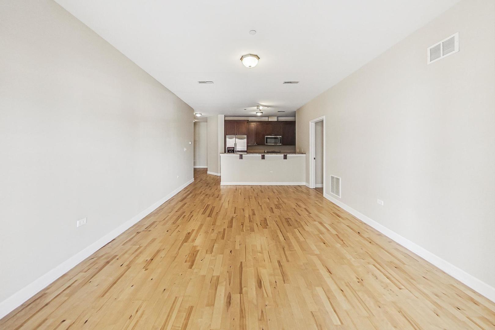 50 North Plum Grove Road, Unit 210E Palatine, IL 60067 - Photo 17 of 47 a view of a kitchen with wooden floor