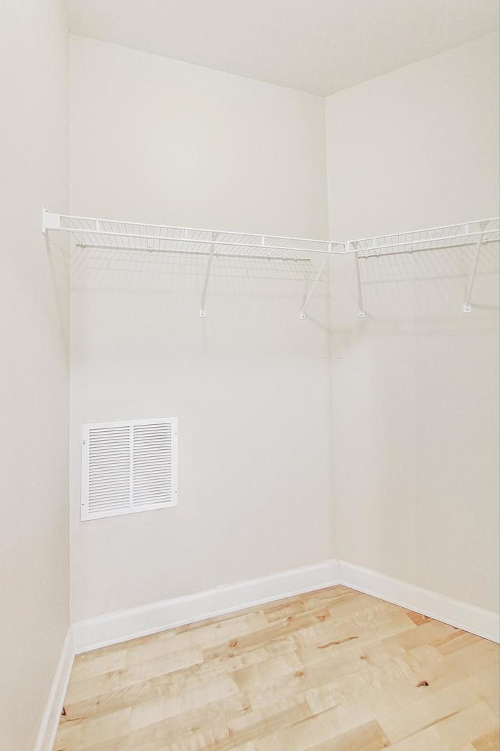 50 North Plum Grove Road, Unit 210E Palatine, IL 60067 - Photo 22 of 47 a view of a room with racks on the wall