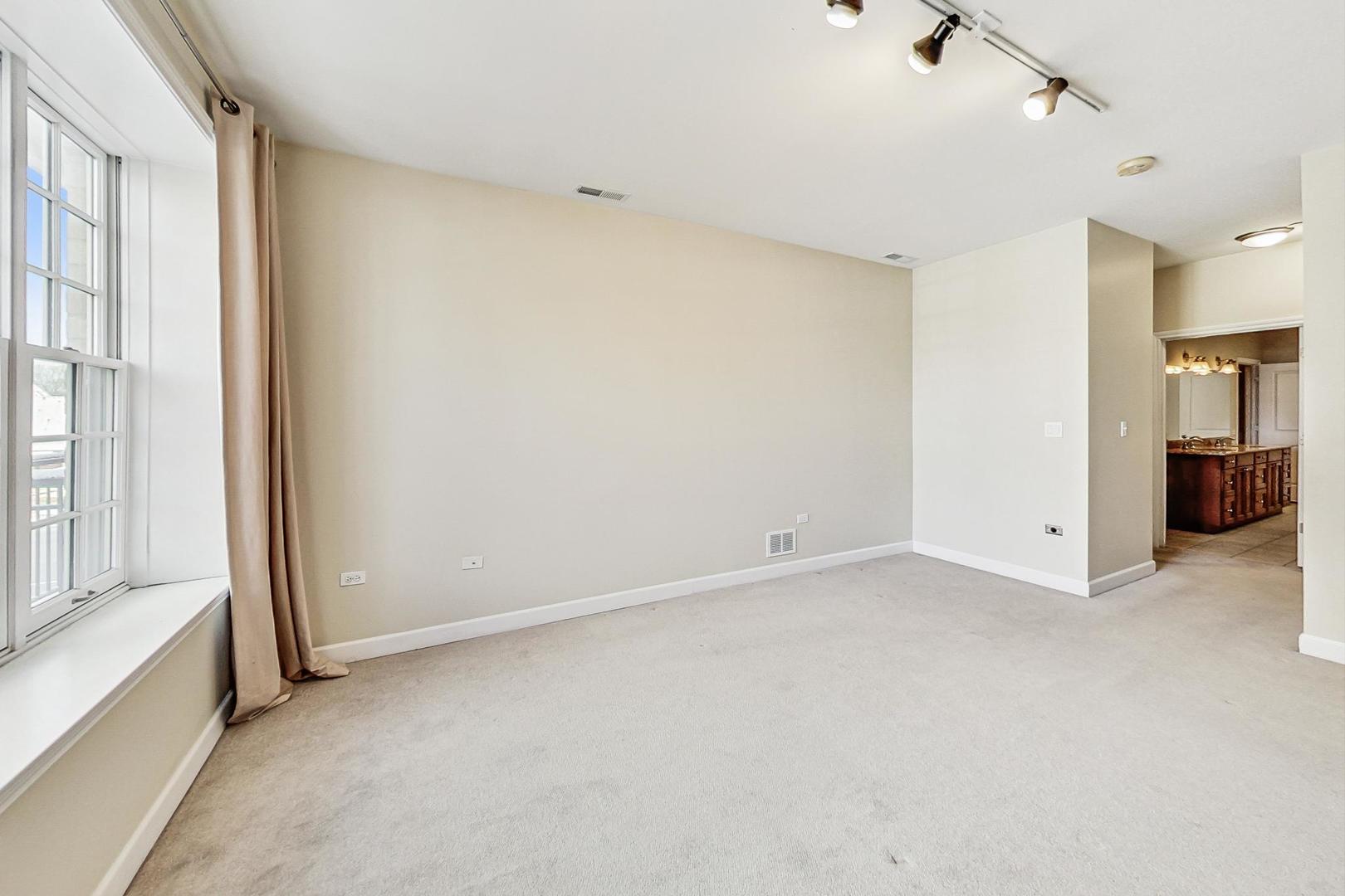 50 North Plum Grove Road, Unit 210E Palatine, IL 60067 - Photo 25 of 47 a view of an empty room