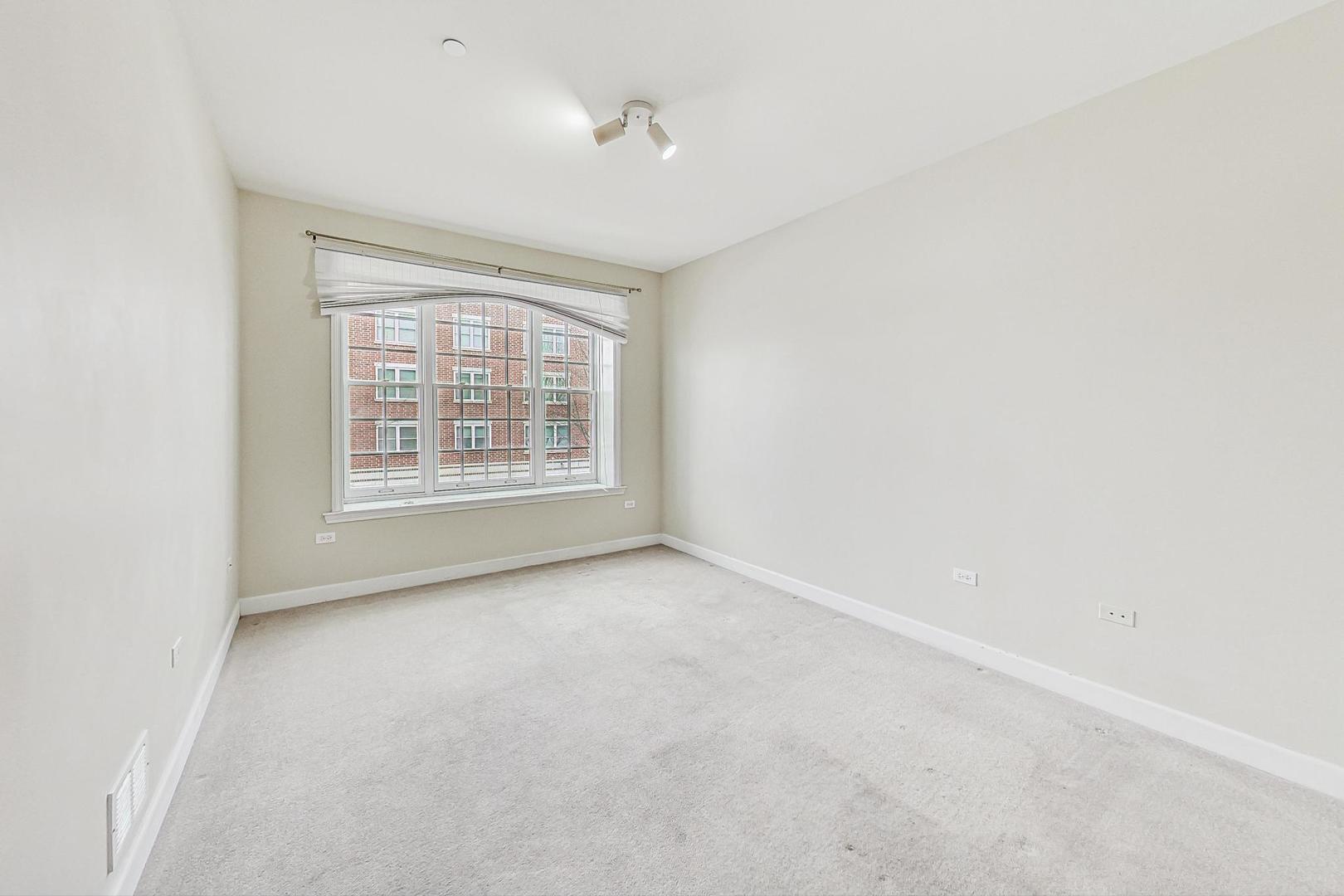 50 North Plum Grove Road, Unit 210E Palatine, IL 60067 - Photo 29 of 47 an empty room with windows