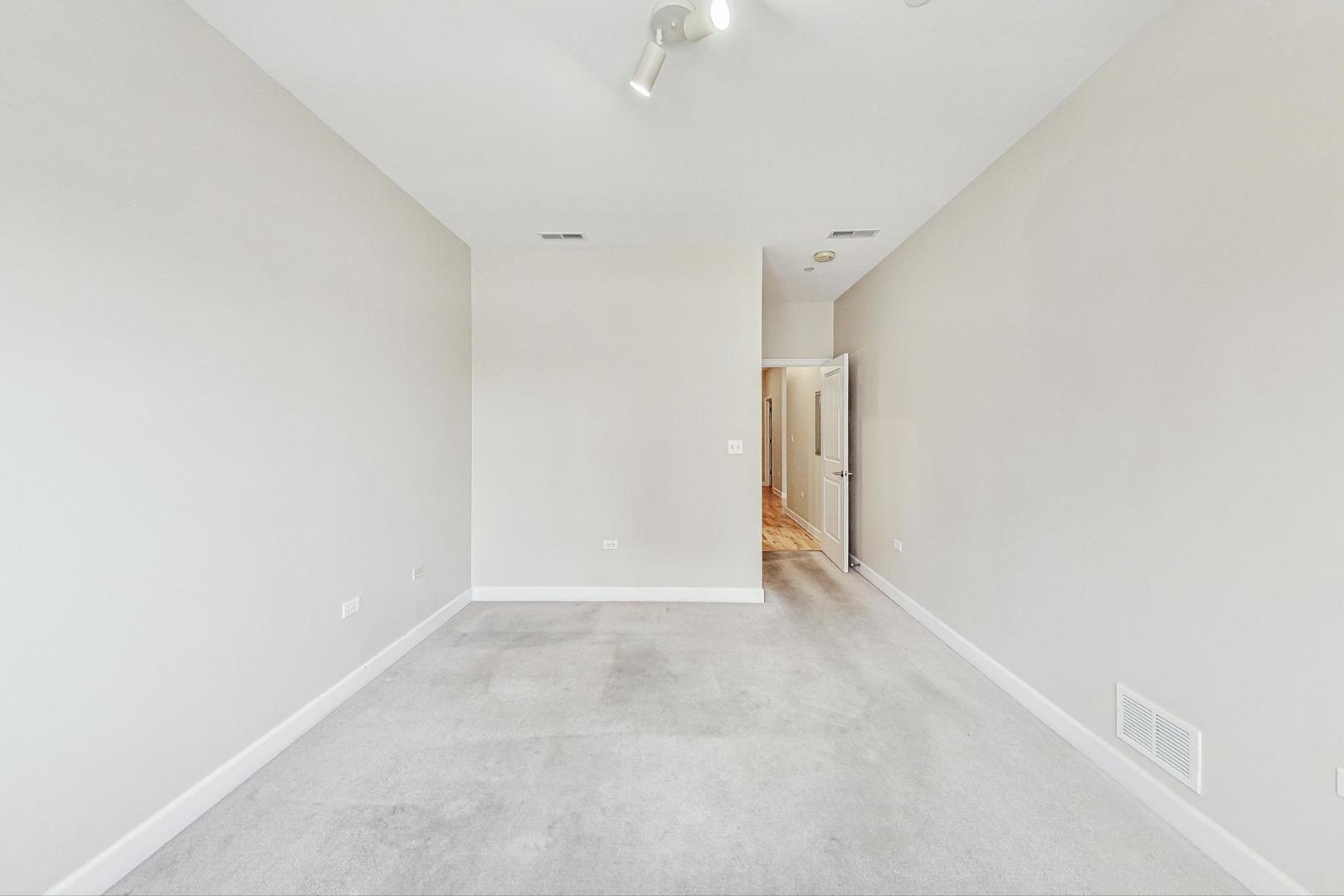 50 North Plum Grove Road, Unit 210E Palatine, IL 60067 - Photo 30 of 47 a view of an empty room