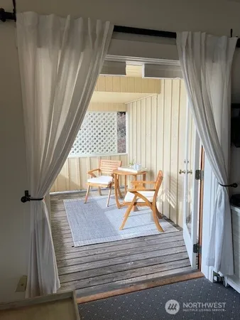 a dining room with wooden floor and a table