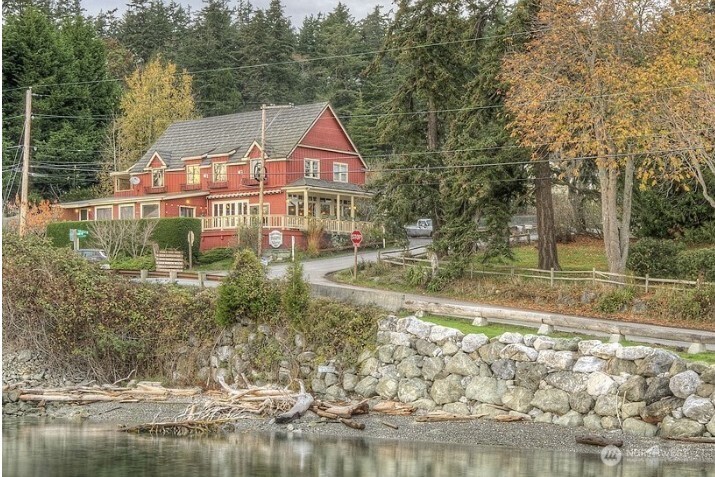 4362 Crow Valley Road Orcas Island, WA 98245 - Photo 2 of 24 a view of a town with large trees and a small yard