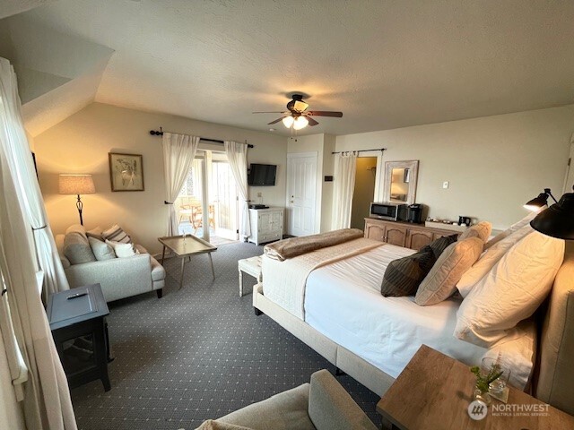 4362 Crow Valley Road Orcas Island, WA 98245 - Photo 22 of 24 a bedroom with bed couch and window