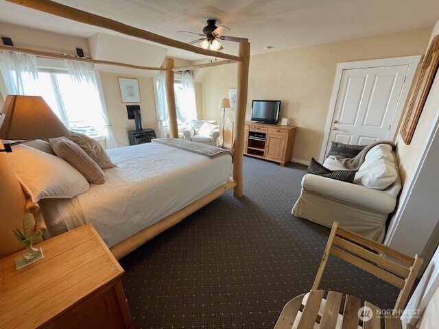 4362 Crow Valley Road Orcas Island, WA 98245 - Photo 23 of 24 a bedroom with a bed couch and a window