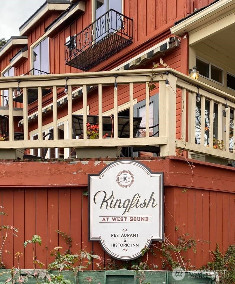 4362 Crow Valley Road Orcas Island, WA 98245 - Photo 6 of 24 a front view of a building with parking and a sign