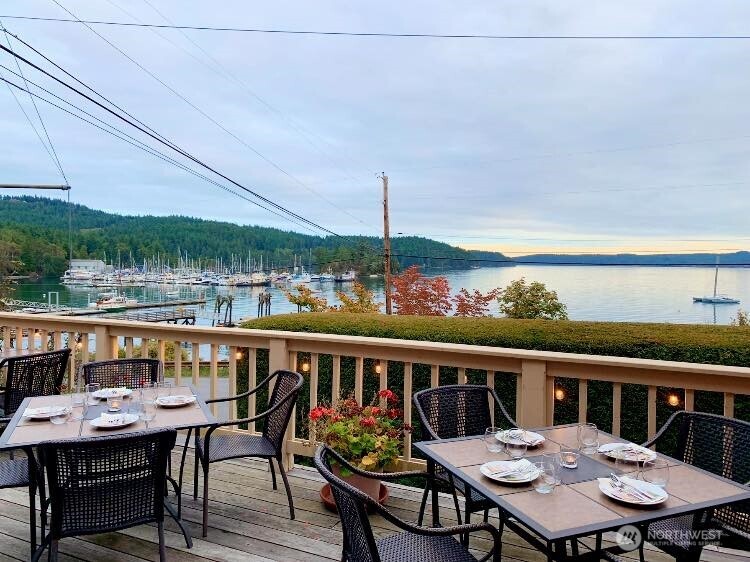 4362 Crow Valley Road Orcas Island, WA 98245 - Photo 7 of 24 a view of a balcony with table and chairs