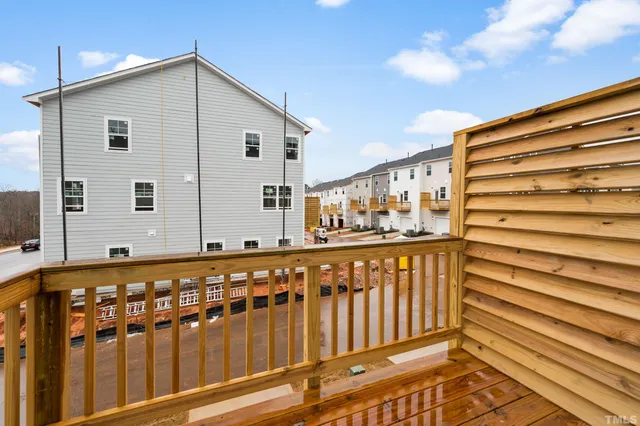 a view of wooden house with a large window