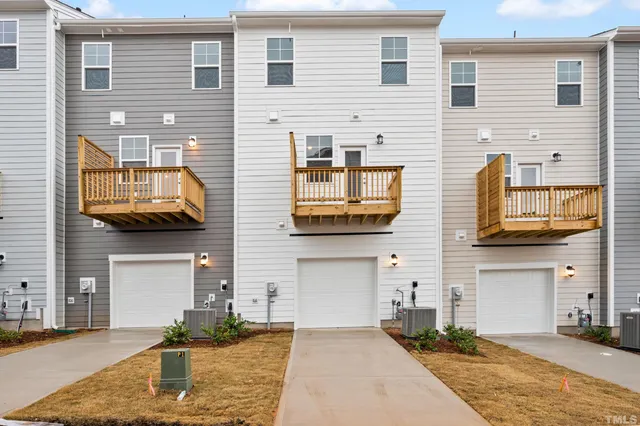 a front view of a house with yard