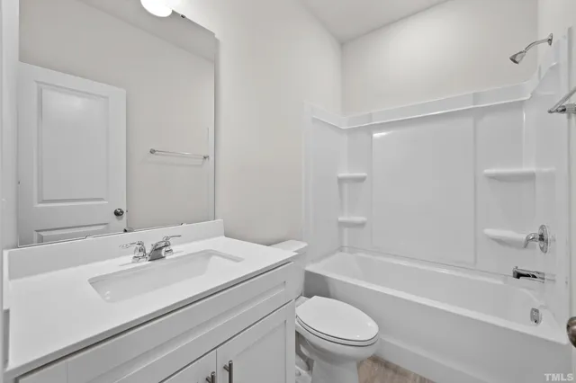 a bathroom with a sink a toilet and a bathtub