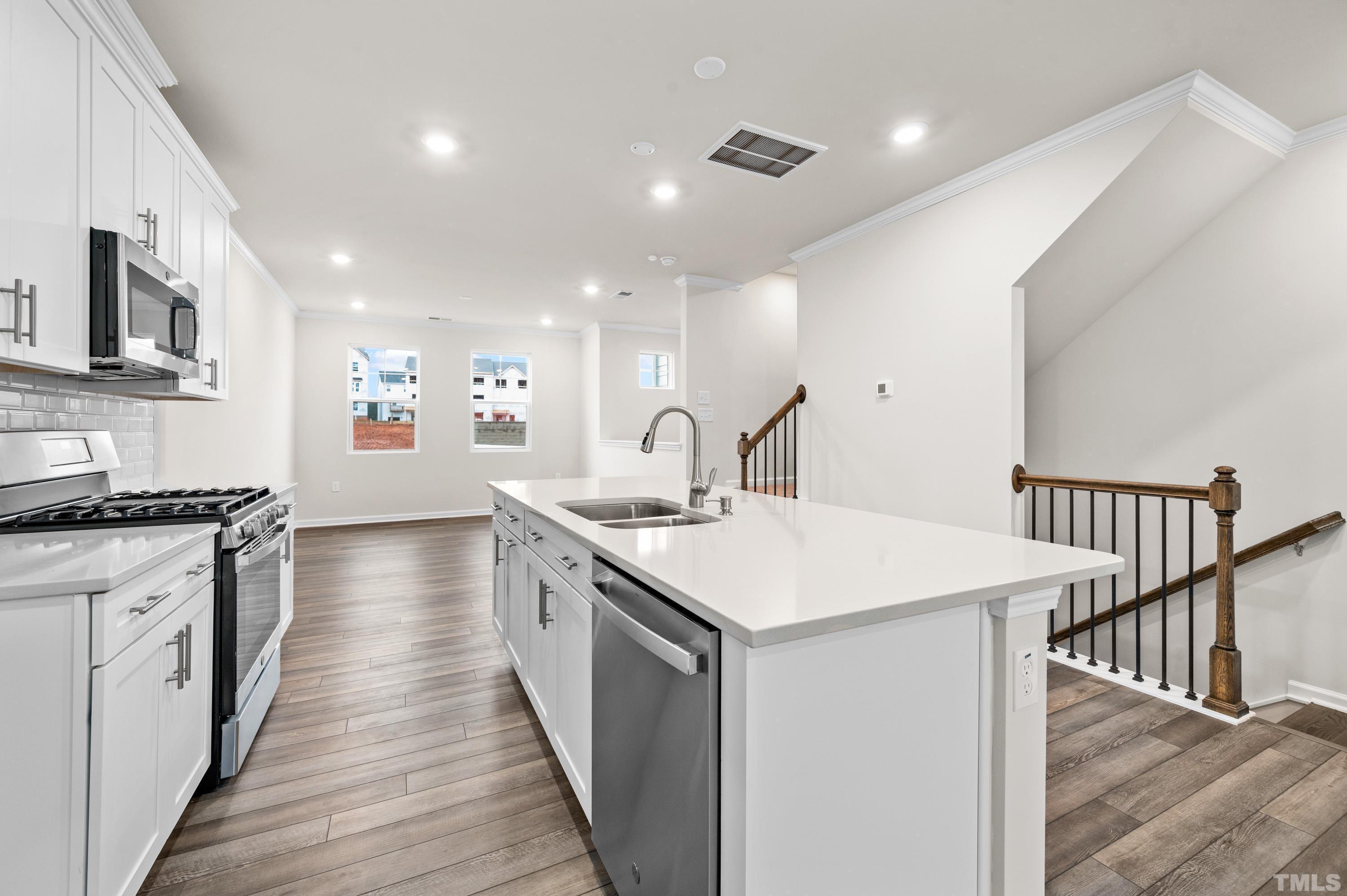 414 Odham Lane Wake Forest, NC 27587 - Photo 5 of 29 a kitchen with sink stove and oven