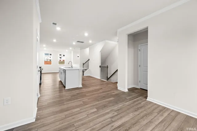a view of a living room with wooden floor