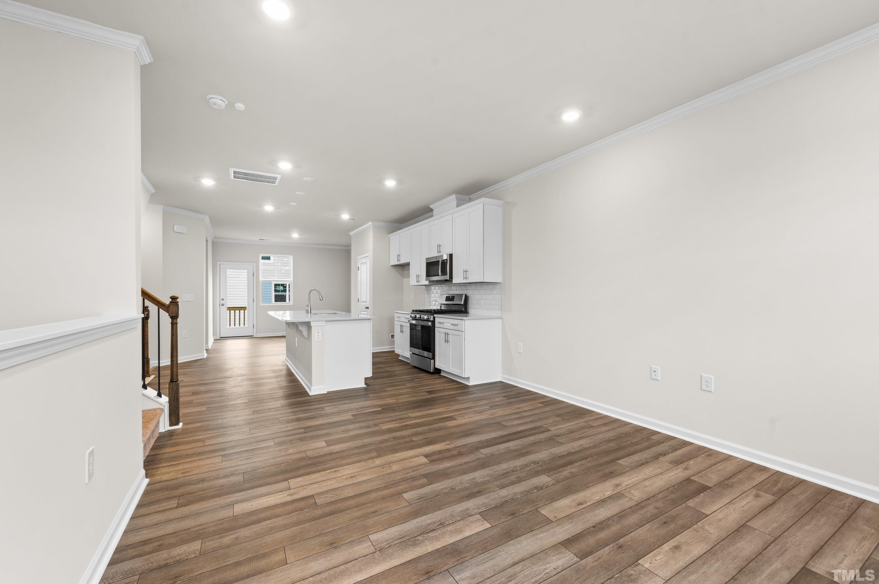 414 Odham Lane Wake Forest, NC 27587 - Photo 8 of 29 a view of kitchen dining table chairs microwave and cabinets