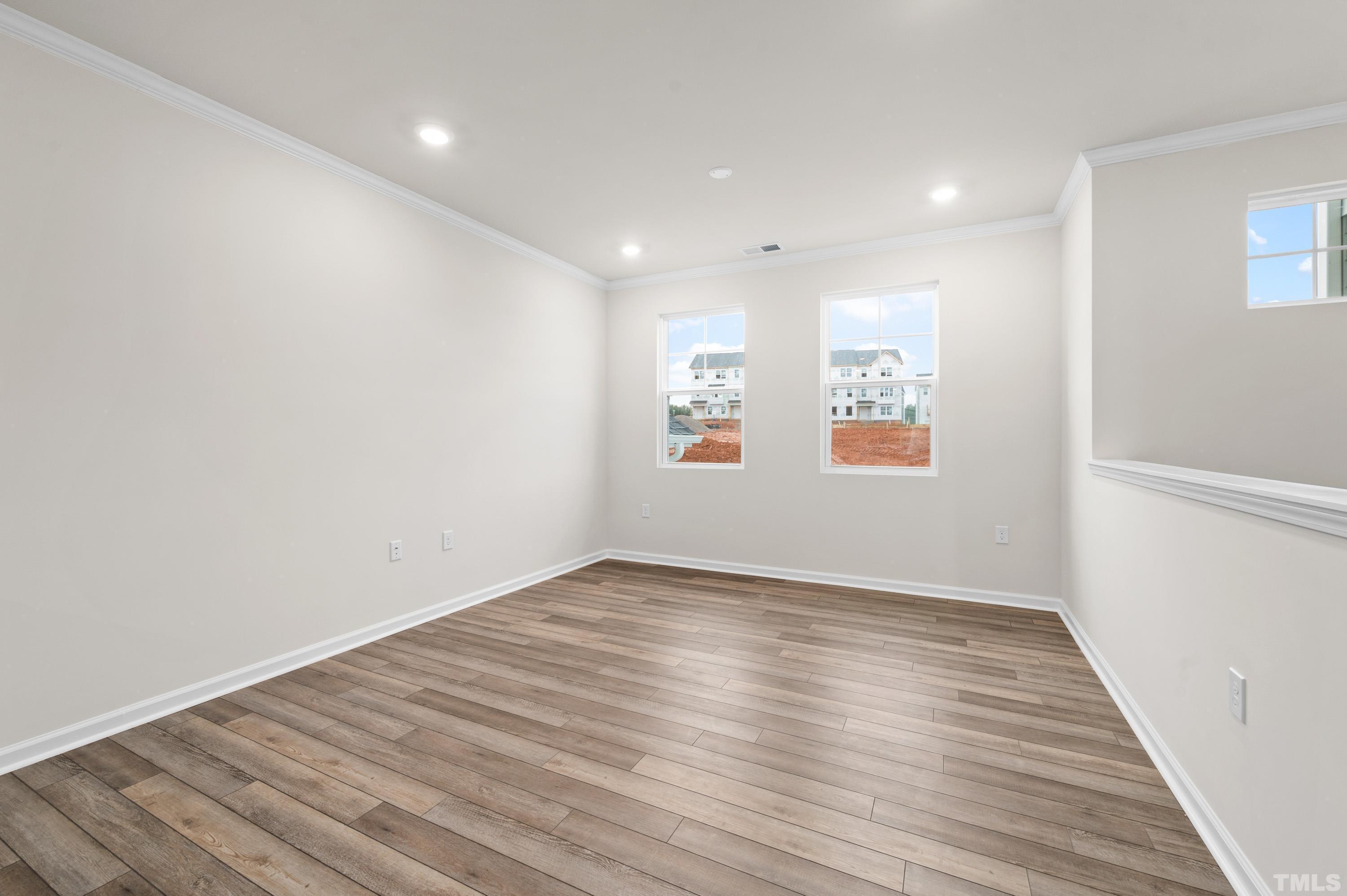414 Odham Lane Wake Forest, NC 27587 - Photo 10 of 29 wooden floor in an empty room with a window