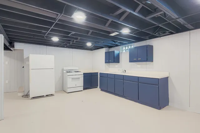 a kitchen with a stove and cabinets