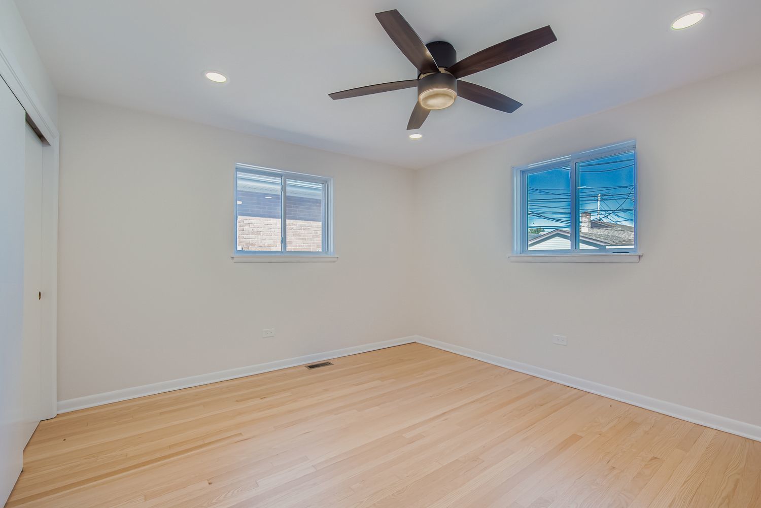 3600 West 115th Street Chicago, IL 60655 - Photo 8 of 17 a view of a big room with wooden floor and windows