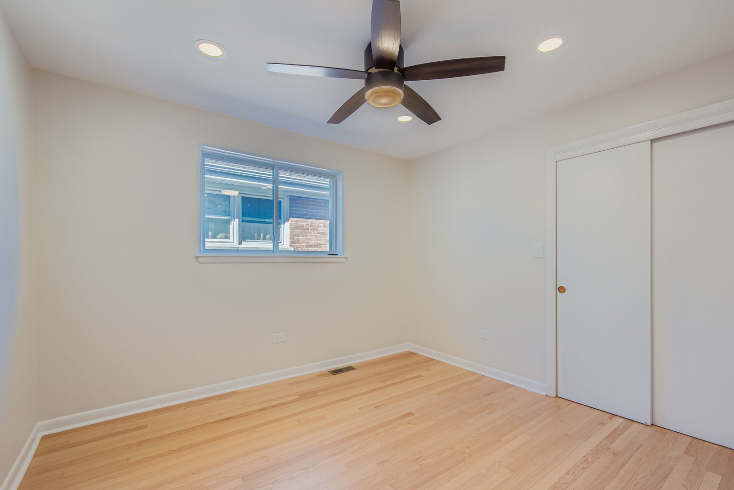 3600 West 115th Street Chicago, IL 60655 - Photo 10 of 17 an empty room with a window and a fan