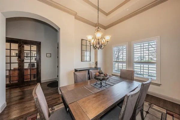 a living room with furniture a ceiling fan and a window