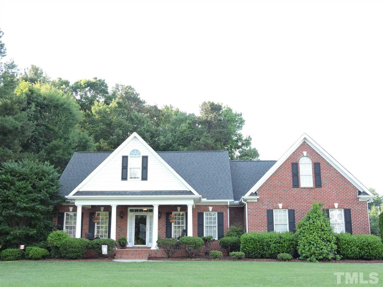 170 Fletcher Ridge Road Timberlake, NC 27583 - Photo 1 of 25 a front view of a house with a yard