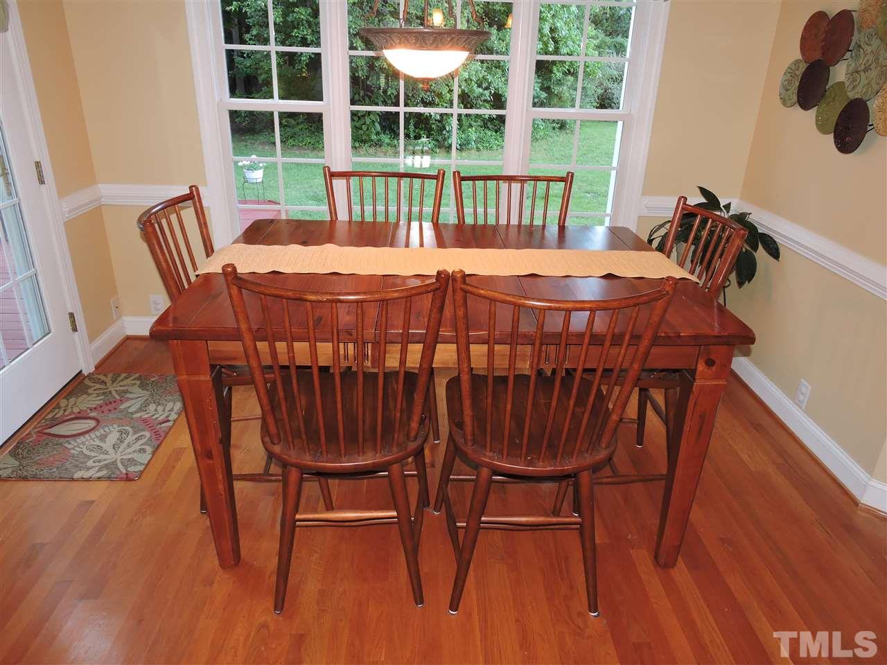 170 Fletcher Ridge Road Timberlake, NC 27583 - Photo 12 of 25 a view of a dining room with furniture window and wooden floor