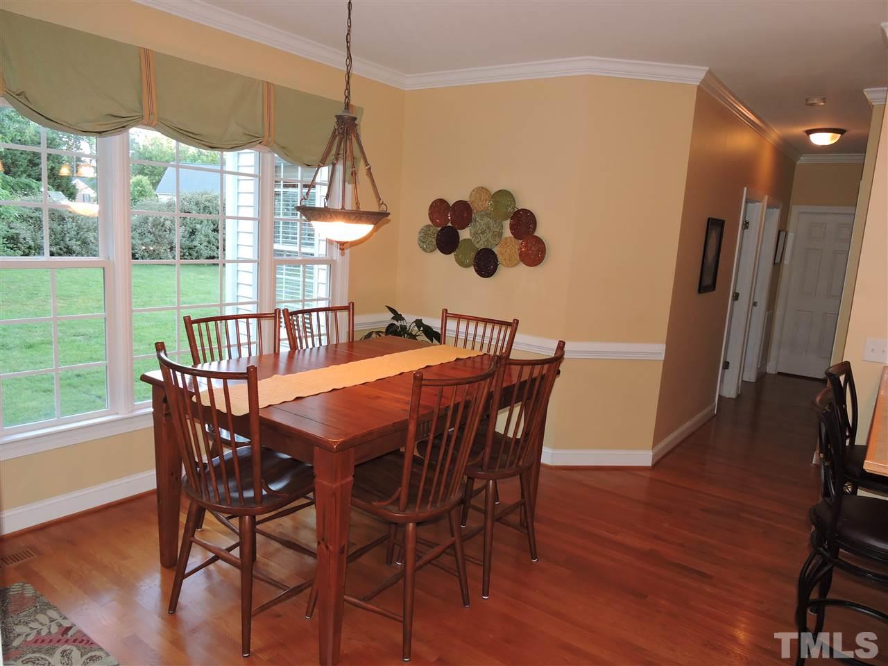170 Fletcher Ridge Road Timberlake, NC 27583 - Photo 13 of 25 a view of a dining room with furniture window and wooden floor