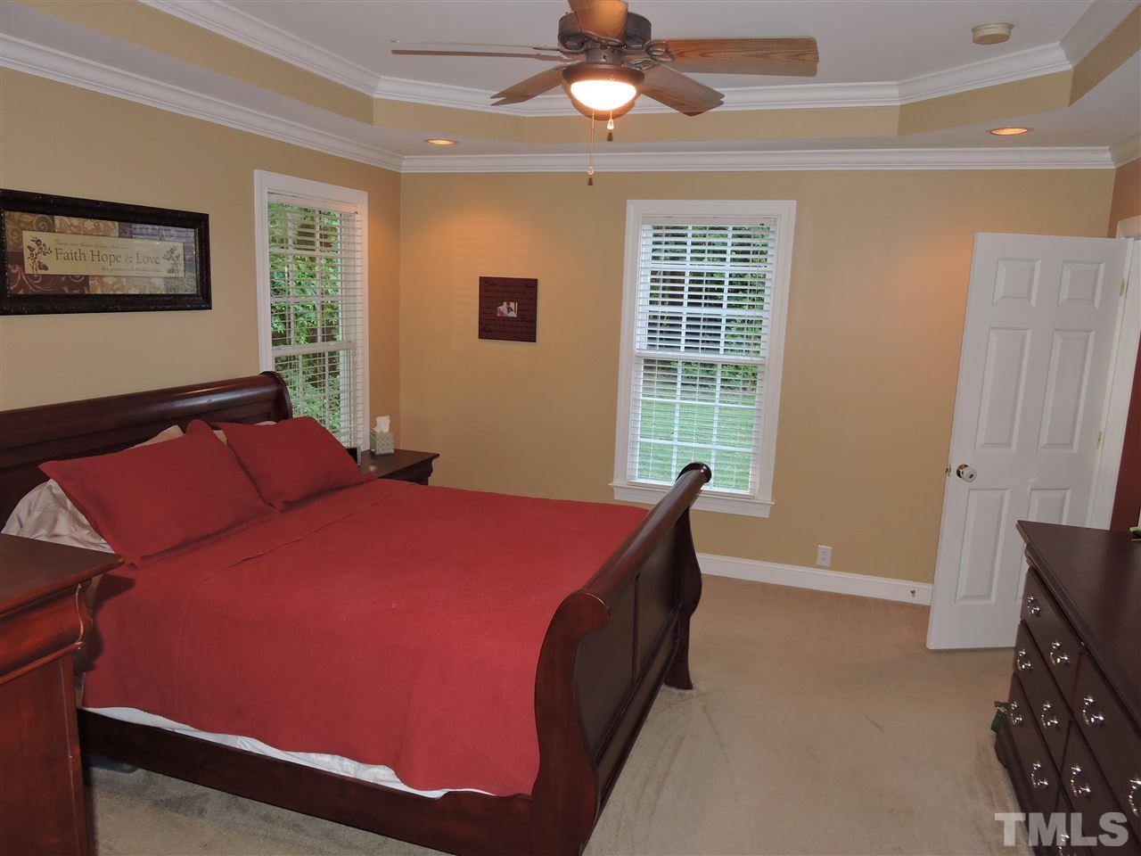 170 Fletcher Ridge Road Timberlake, NC 27583 - Photo 14 of 25 a bed room with a bed and a window