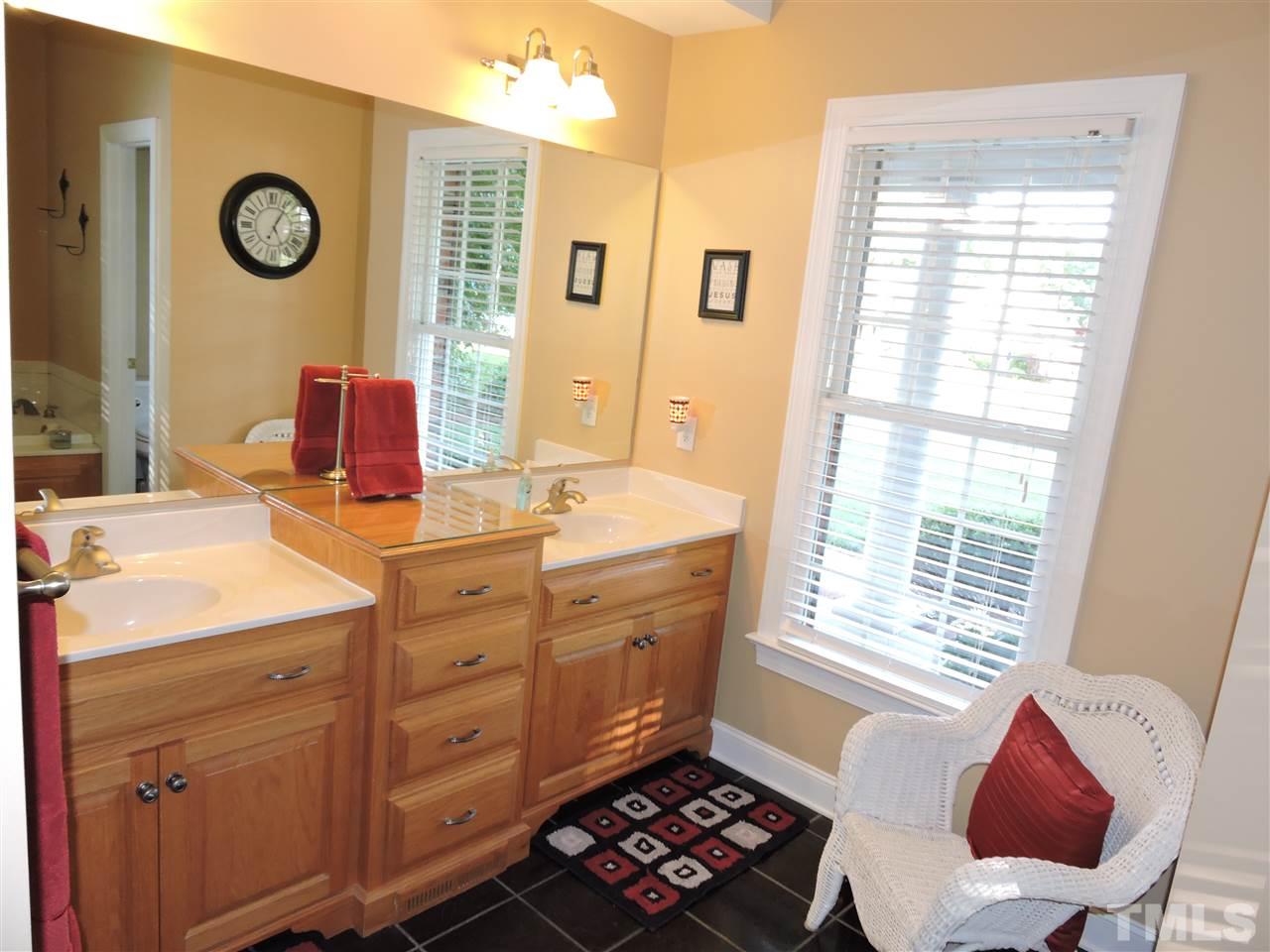 170 Fletcher Ridge Road Timberlake, NC 27583 - Photo 17 of 25 a bathroom with a sink and a mirror