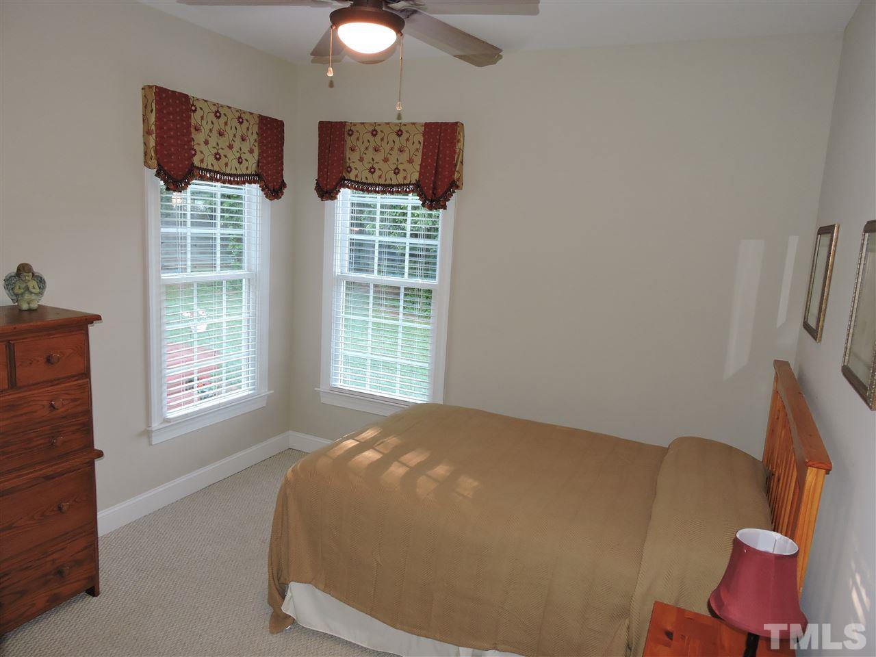 170 Fletcher Ridge Road Timberlake, NC 27583 - Photo 18 of 25 a bedroom with a bed and window