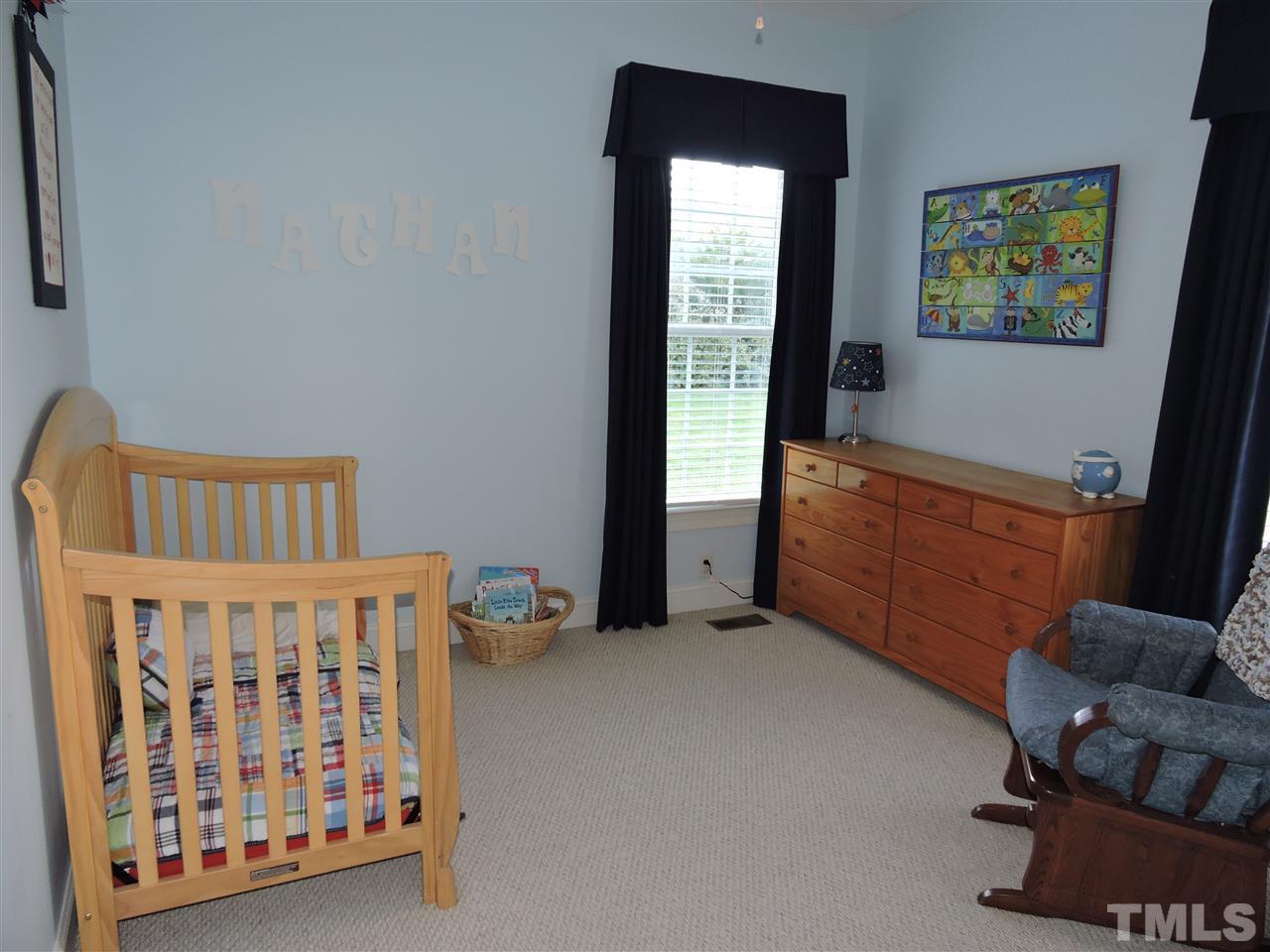 170 Fletcher Ridge Road Timberlake, NC 27583 - Photo 19 of 25 a bedroom with furniture and a window