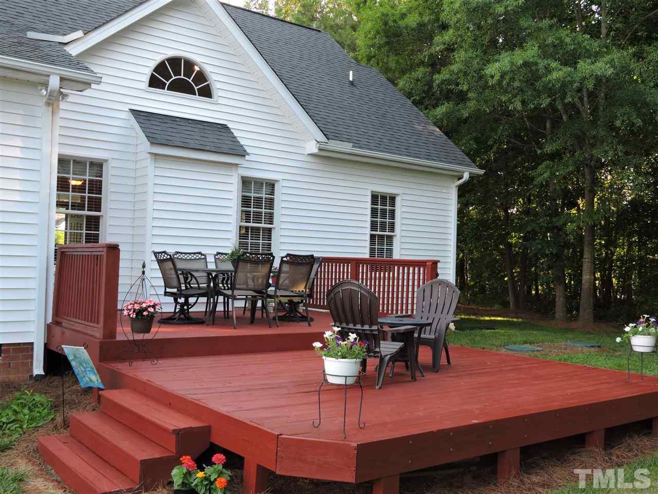 170 Fletcher Ridge Road Timberlake, NC 27583 - Photo 23 of 25 a view of a backyard with sitting area furniture and wooden floor