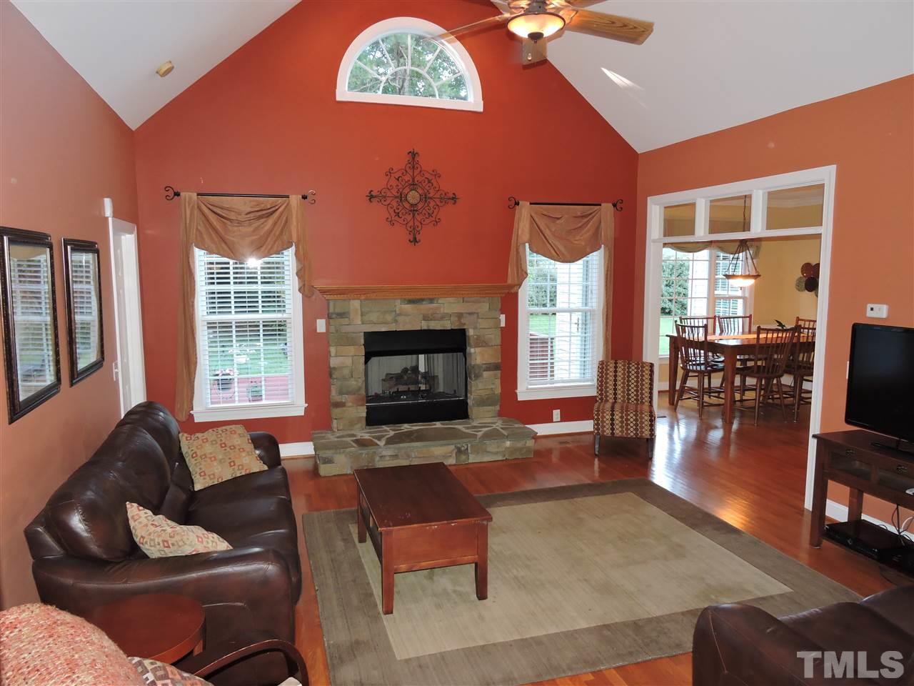 170 Fletcher Ridge Road Timberlake, NC 27583 - Photo 4 of 25 a living room with furniture fireplace and flat screen tv