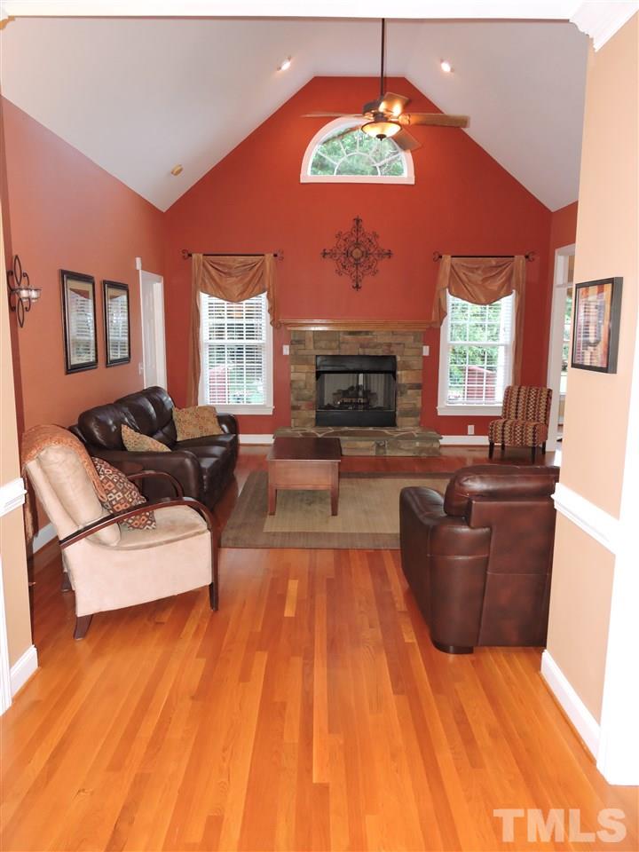 170 Fletcher Ridge Road Timberlake, NC 27583 - Photo 10 of 25 a living room with furniture and a fireplace