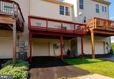 a front view of a house with garage
