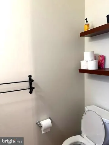 a bathroom with a toilet and a sink
