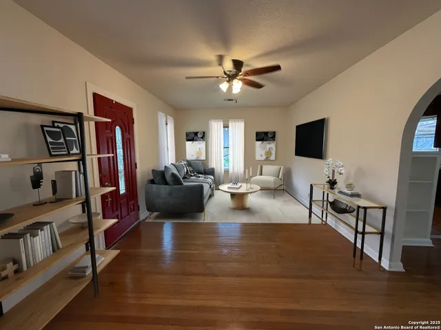 a living room with furniture and a flat screen tv